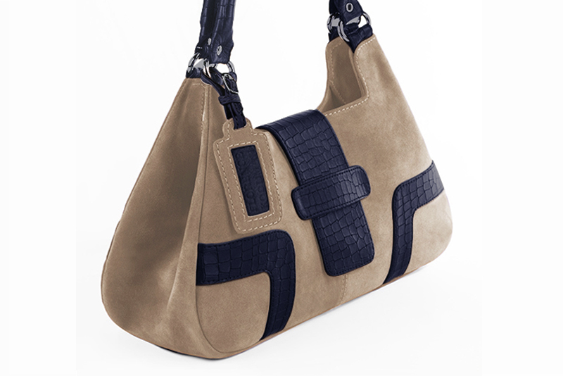 Handcrafted women's luxurious elegant handbag in premium tan beige and navy blue leather. Perfect for elevated everyday style.   
                Choose from our luxurious collections of leather and fabric to perfectly match your handbags to your outfits.